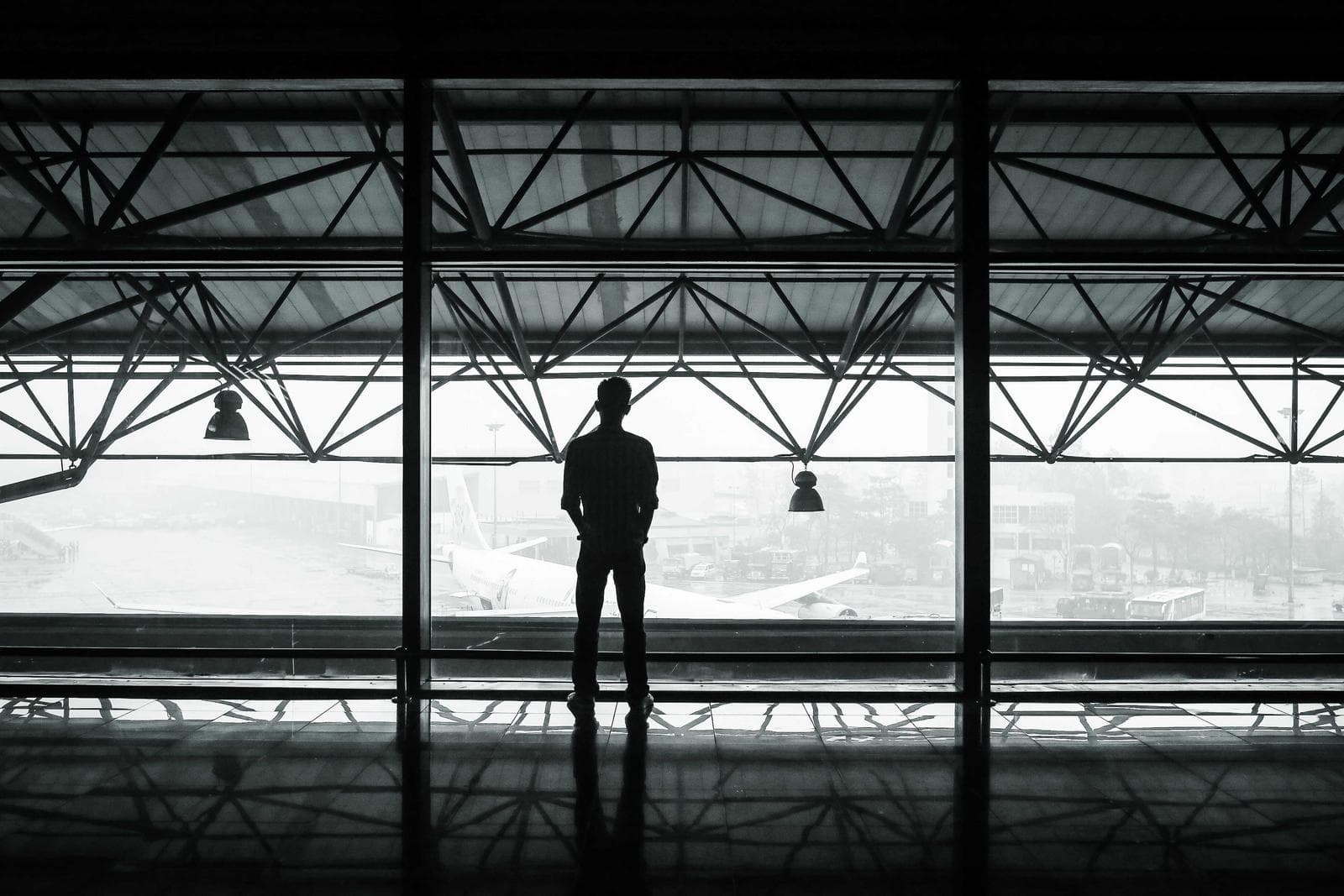 A lone figure waiting on a platform