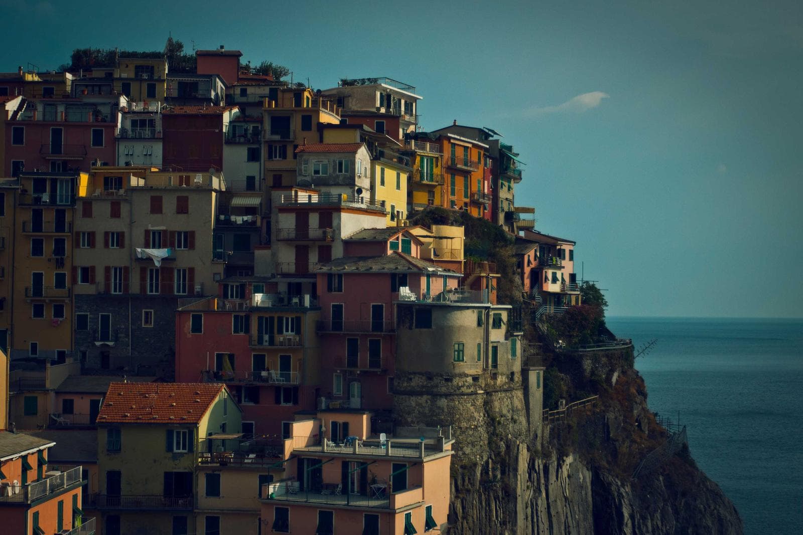 Painted houses stacked up a hillside