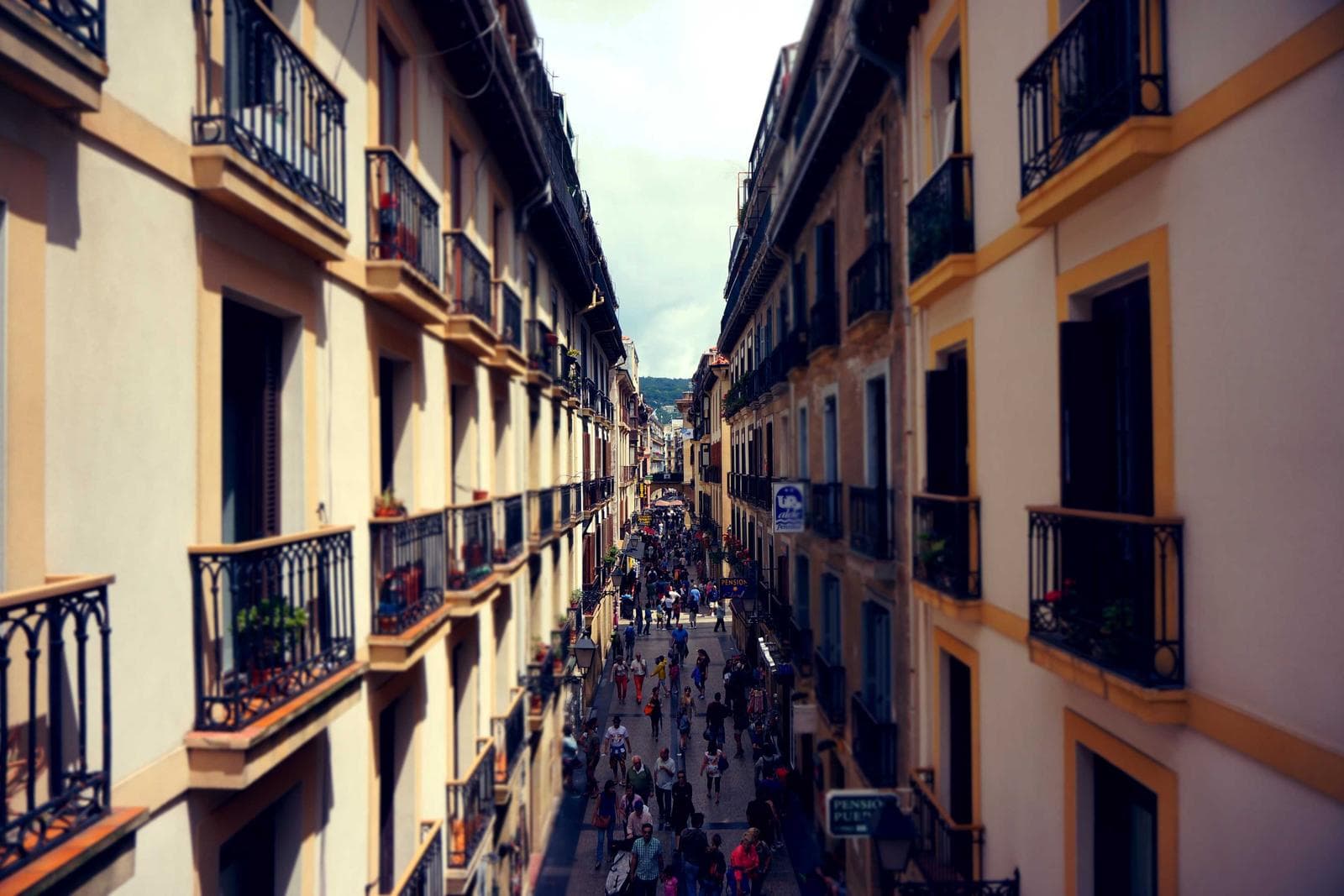 A narrow street between tall buildings